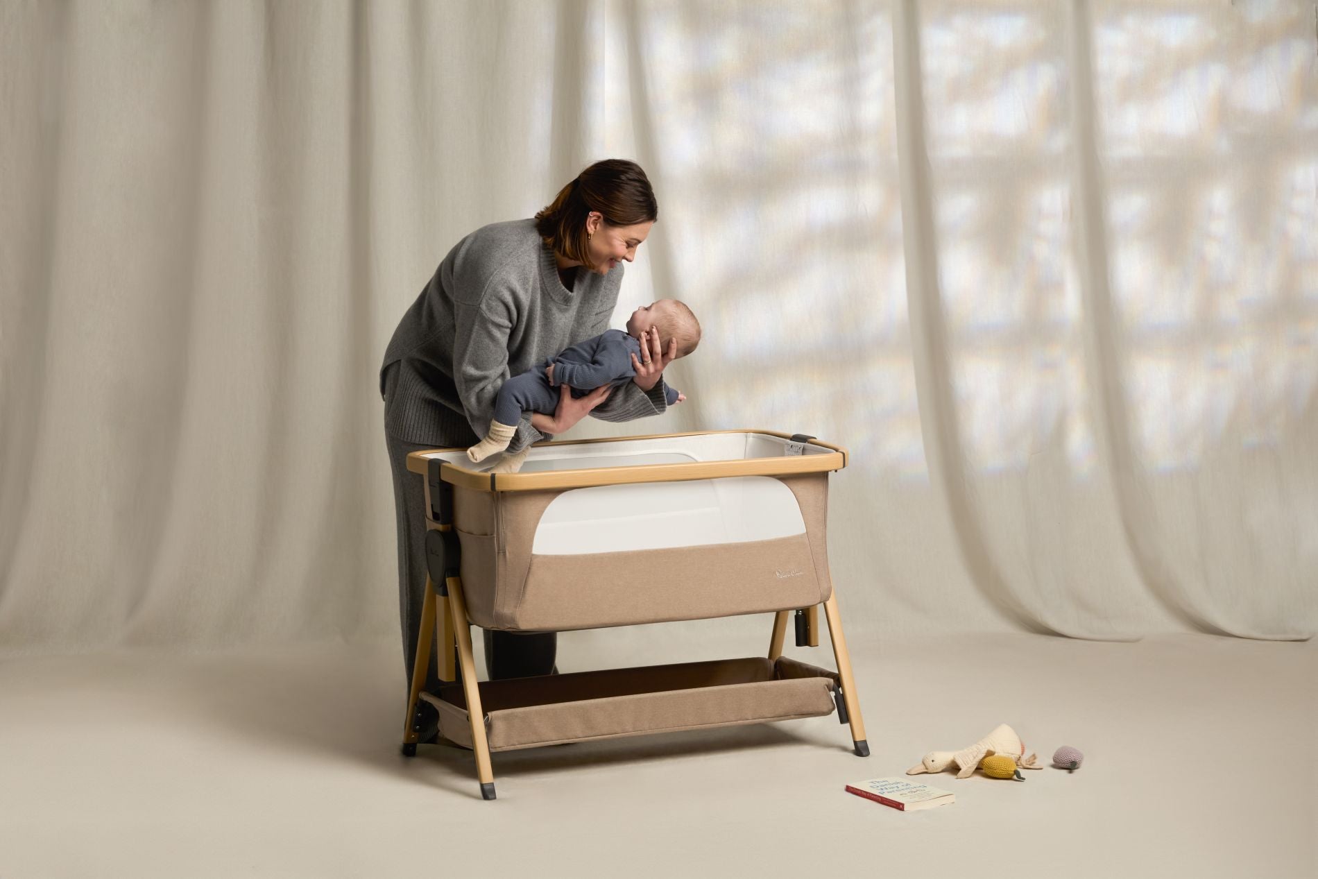 Lunar_Crib_3_4_Lifting_Baby_into_Crib | Natural Baby Shower