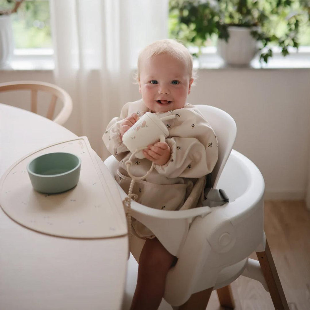 Mushie Long Sleeve Bib - Cream Bees-Bibs-Cream Bees- | Natural Baby Shower